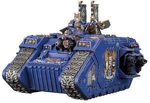1024px-Space-Marine-Land-Raider-Exelsior-Command-Tank.jpg