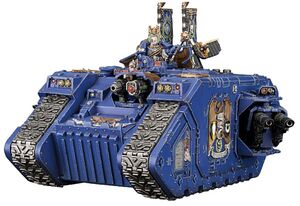 1200px-Space-Marine-Land-Raider-Exelsior-Command-Tank.jpg