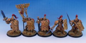 1200px-Warhammer-40k-Adeptus-Custodes-Sentinel-Guard-x5-Burning.jpg